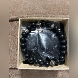 Black beaded bracket